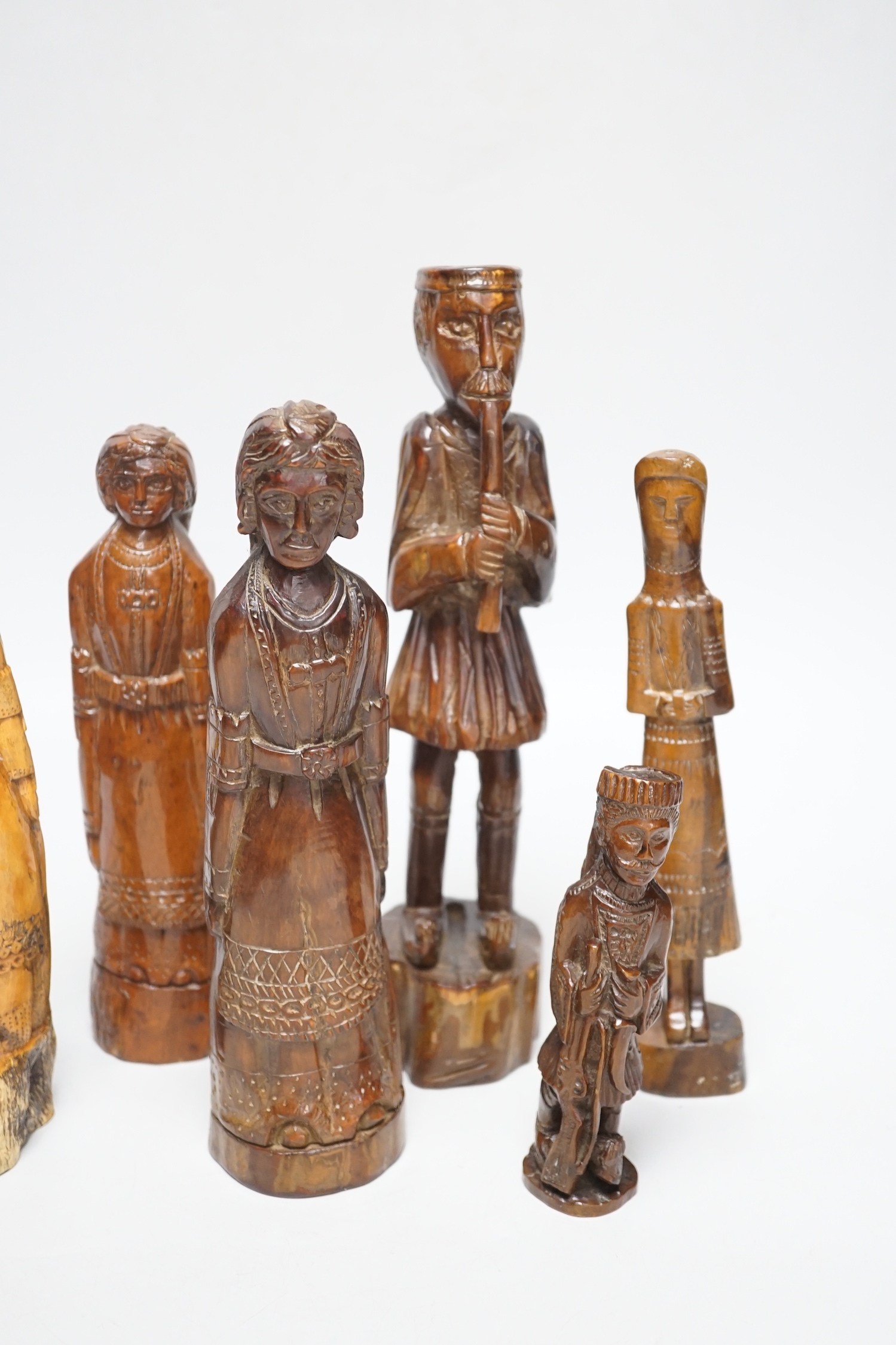 A collection of Greek carved olivewood and treen carved figures, 19th century, largest 25cm